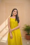 Mustard Yellow Sleeveless Kurta Palazzo With Tie-Up Detailing.