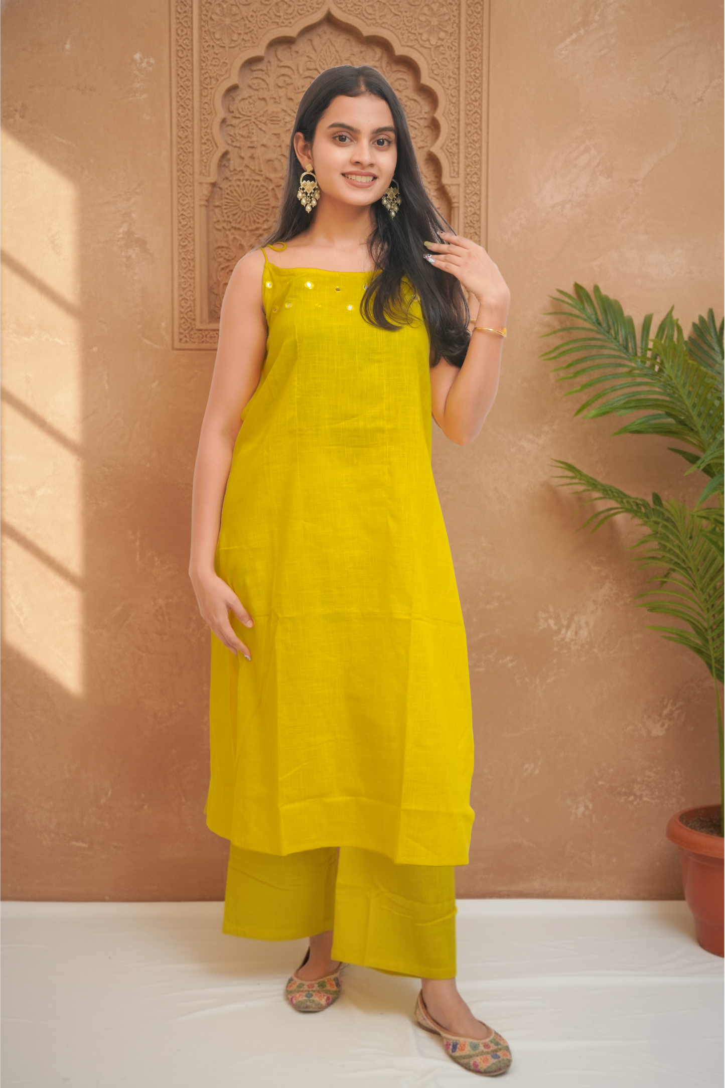 Mustard Yellow Sleeveless Kurta Palazzo With Tie-Up Detailing.