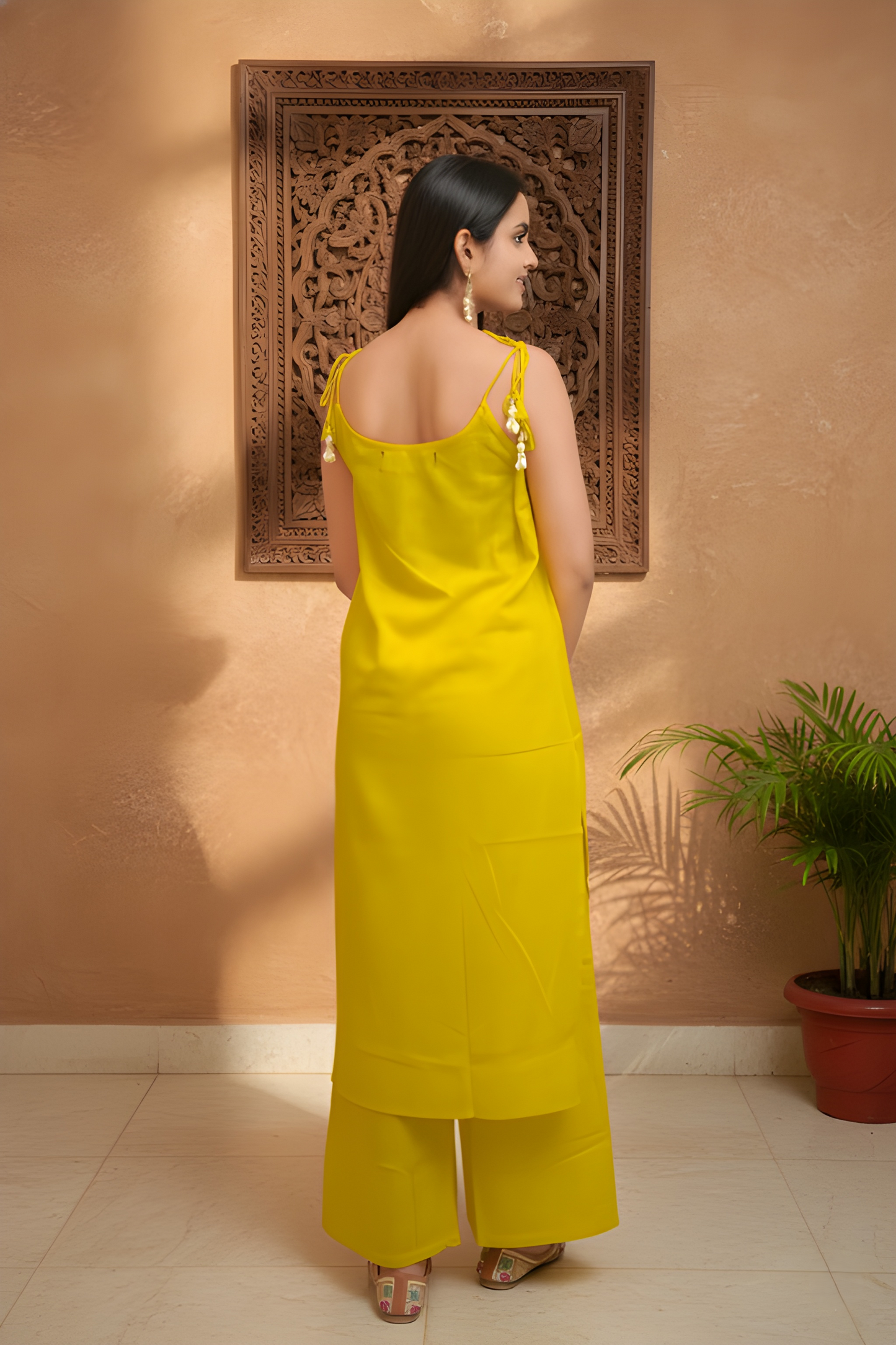 Mustard Yellow Sleeveless Kurta Palazzo With Tie-Up Detailing.